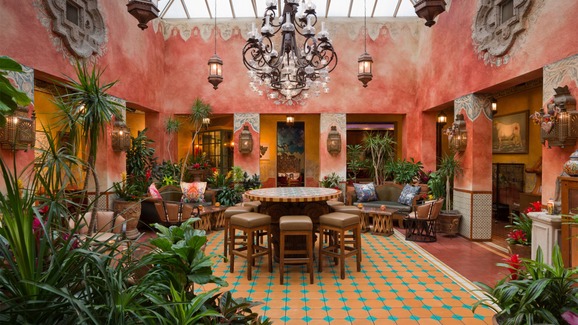 pink restaurant interior with dining table and chairs